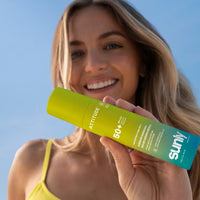 Sunly Mineral Sunscreen Spray SPF 50 application lifestyle photo