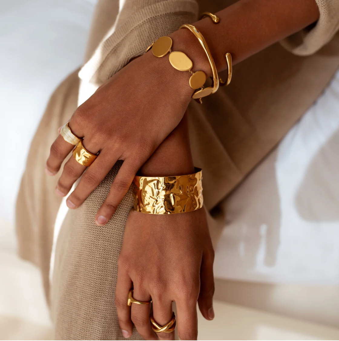 Siren Cuff Gold worn on wrist lifestyle photo